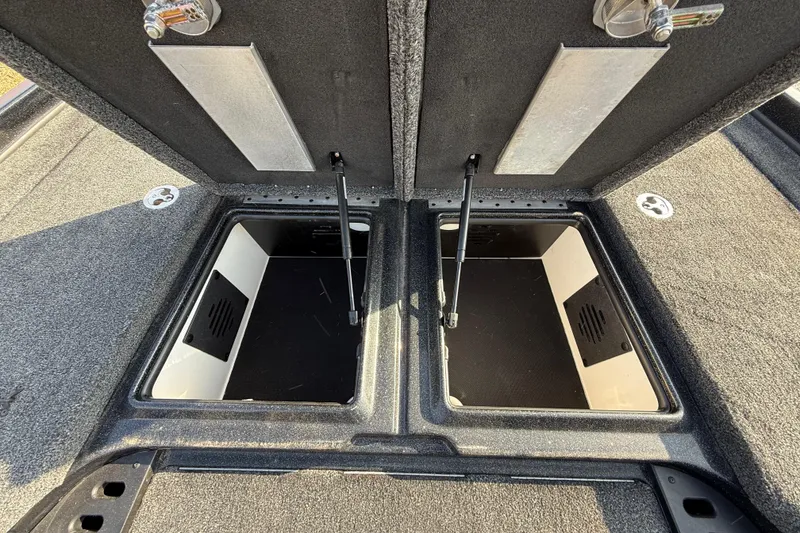 Slide: The Image of Open storage compartments on a 2019 Nitro Z21 Pro boat deck. - 48