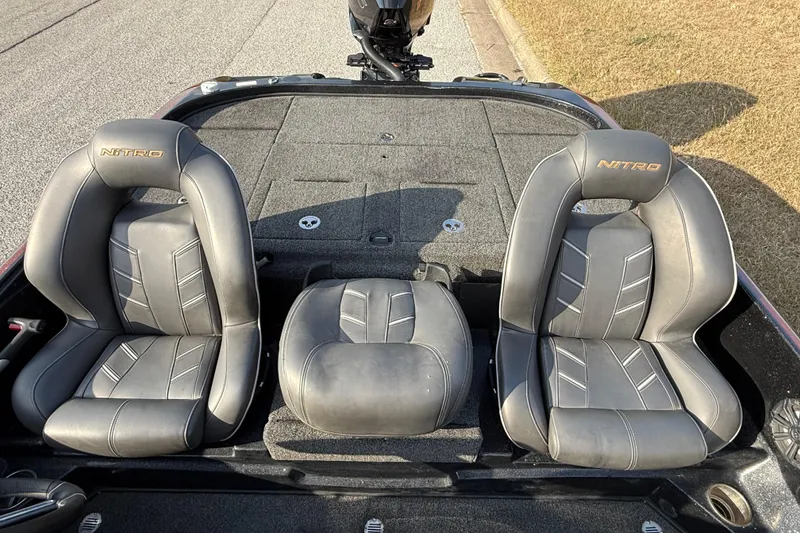 Slide: The Image of 2019 Nitro Z21 Pro boat seats, gray leather, embroidered logo, outdoor setting. - 53