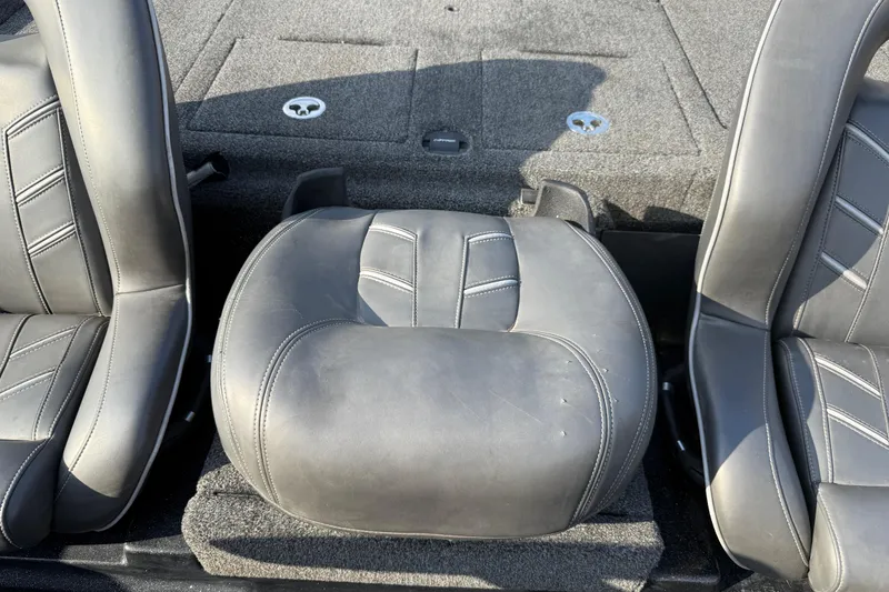 Slide: The Image of 2019 Nitro Z21 Pro boat interior with gray leather seats and carpeted flooring. - 55