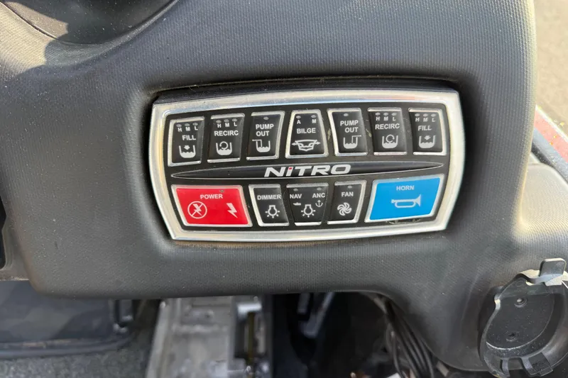 Slide: The Image of Control panel of a 2019 Nitro Z21 Pro boat with various function buttons. - 59