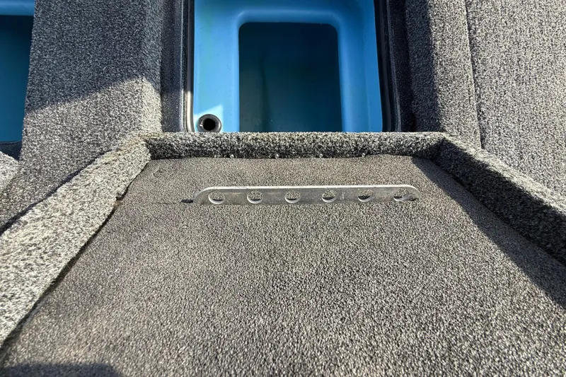 Slide: The Image of 2019 Nitro Z21 Pro boat interior with textured flooring and storage compartment. - 67