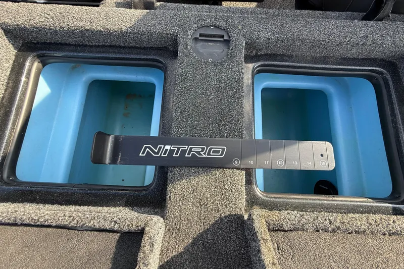 Slide: The Image of 2019 Nitro Z21 Pro boat storage compartments with measuring tool. - 68