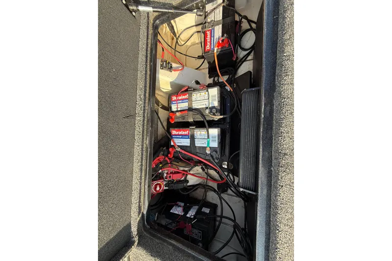 Slide: The Image of 2019 Nitro Z21 Pro boat battery compartment with Duralast marine batteries and wiring. - 70