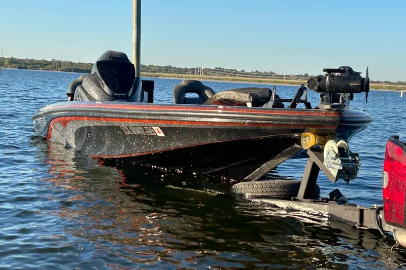 Slide: The Image of 2019 Nitro Z21 Pro boat on trailer, partially submerged in water. - 75