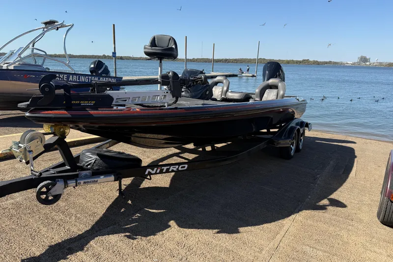 Slide: The Image of 2019 Nitro Z21 Pro boat on trailer by a lake, ready for launch. - 76