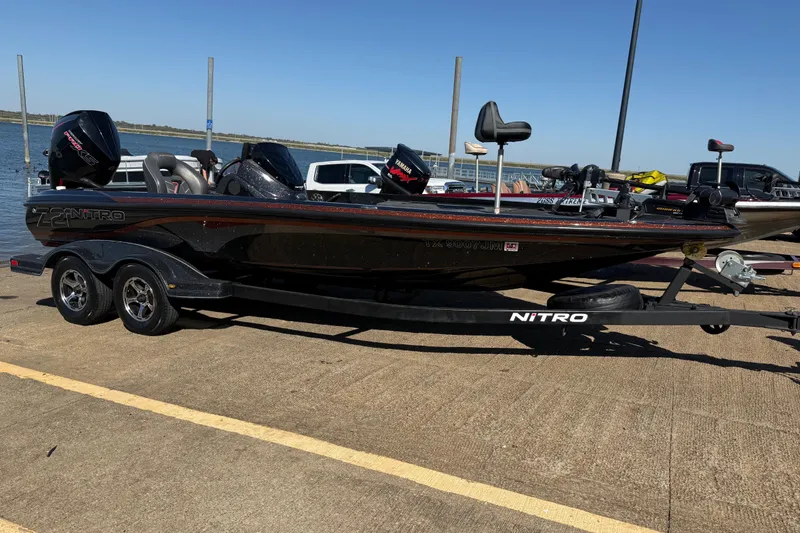 Slide: The Image of 2019 Nitro Z21 Pro bass boat on trailer by the water. - 81