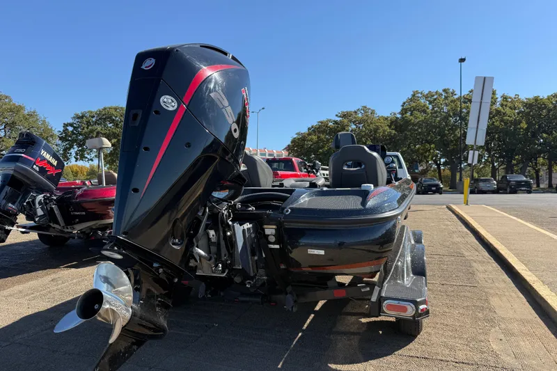 Slide: The Image of 2019 Nitro Z21 Pro boat with powerful outboard motor in parking lot. - 84