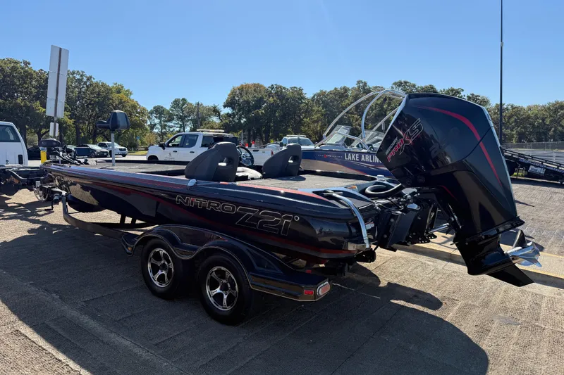 Slide: The Image of 2019 Nitro Z21 Pro boat with powerful engine, parked outdoors on a sunny day. - 87