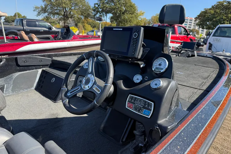 Slide: The Image of 2019 Nitro Z21 Pro boat dashboard with steering wheel and navigation system. - 88