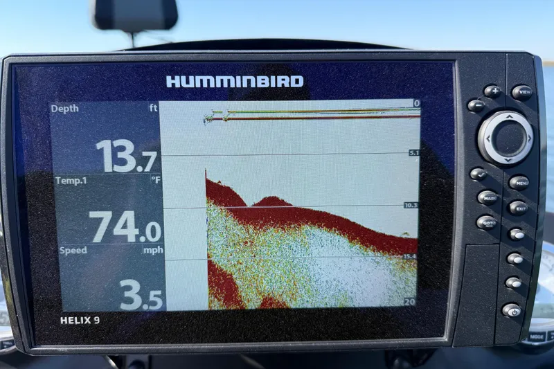 Slide: The Image of Humminbird Helix 9 fishfinder displaying depth, temperature, and speed on a Nitro Z21 Pro boat. - 95