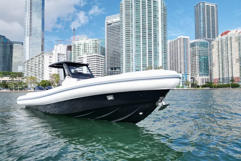 Slide: The Image of 2026 Northstar ORION 10 boat on water with city skyline background. - 2