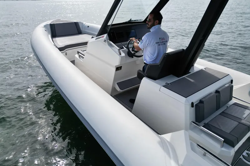 Slide: The Image of 2026 Northstar ORION 10 boat on water, featuring sleek design and modern controls. - 4