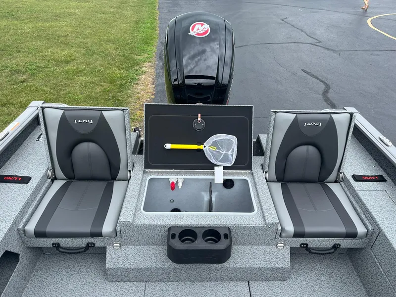 Slide: The Image of 2026 Lund 1775 Impact XS Sport boat interior with seating and fishing equipment. - 9