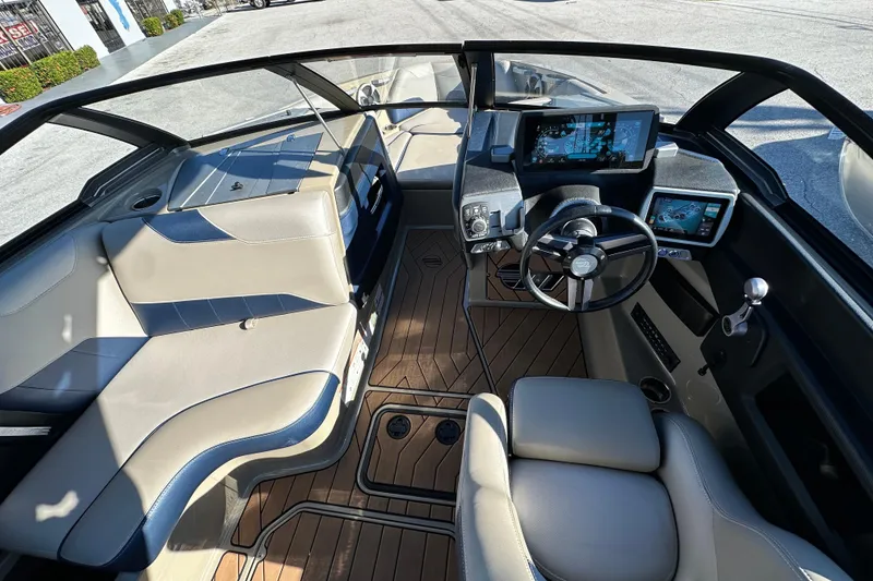 Slide: The Image of 2018 Malibu Wakesetter 23 LSV interior with modern dashboard and seating. - 10