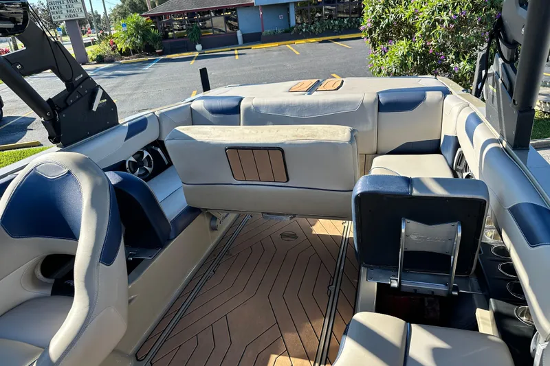 Slide: The Image of 2018 Malibu Wakesetter 23 LSV interior with luxurious seating and modern design. - 18