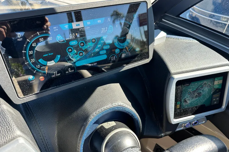Slide: The Image of Dashboard of a 2018 Malibu Wakesetter 23 LSV boat with digital displays. - 27