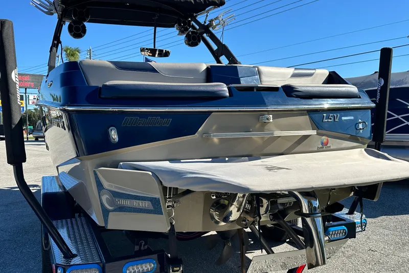 Slide: The Image of 2018 Malibu Wakesetter 23 LSV boat, rear view, on trailer, sunny day. - 5
