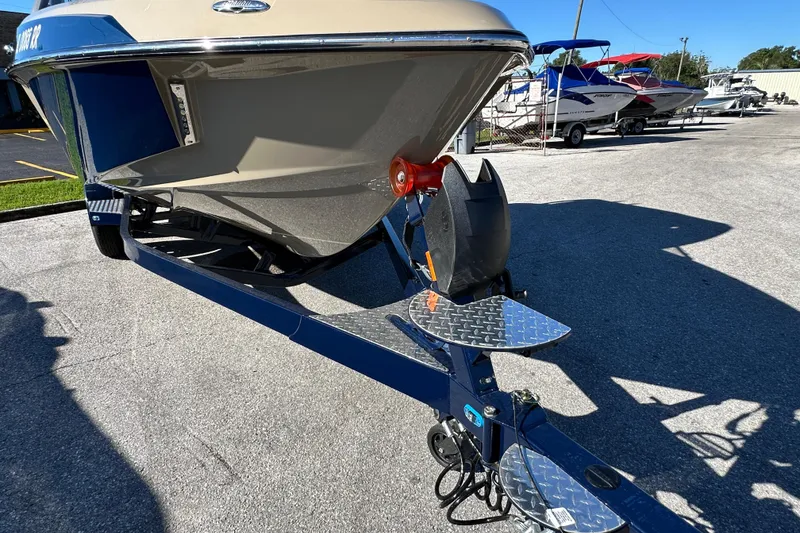 Slide: The Image of 2018 Malibu Wakesetter 23 LSV boat on trailer, parked outdoors. - 7