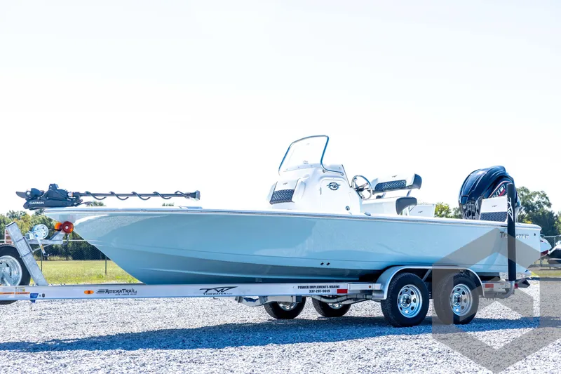 The Image of 2026 Tidewater 2110 Bay Max boat on trailer, side view, outdoors. - 1