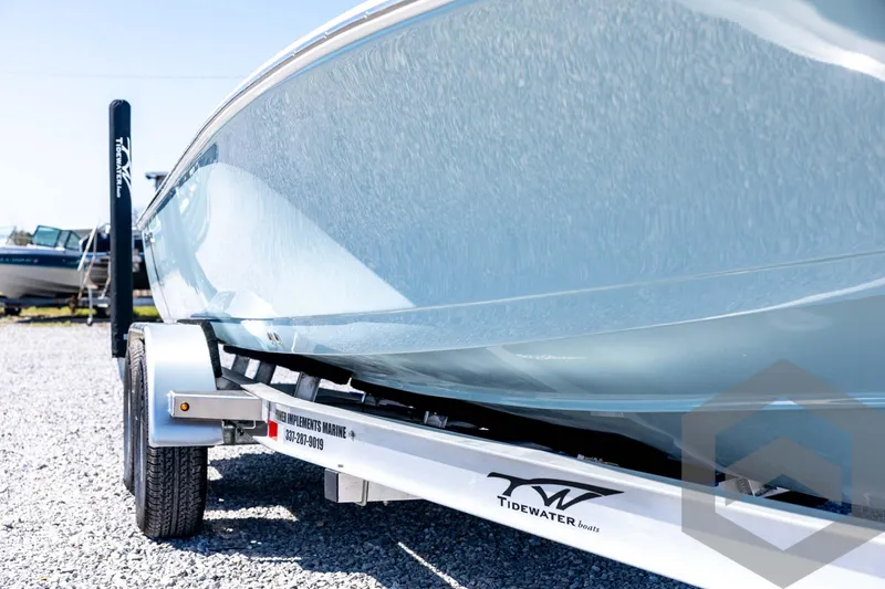 Slide: The Image of 2026 Tidewater 2110 Bay Max boat on trailer, side view, outdoors. - 12