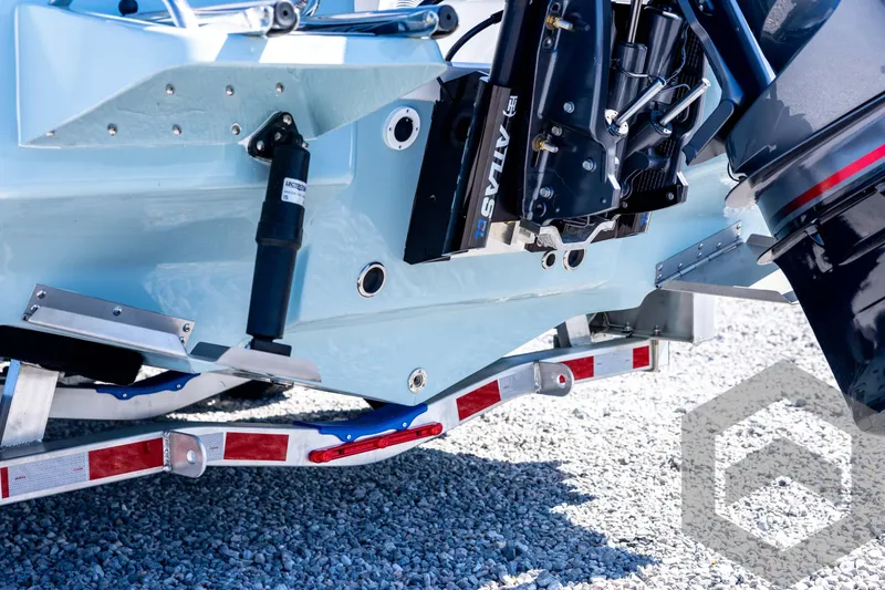 Slide: The Image of 2026 Tidewater 2110 Bay Max boat on trailer, showcasing engine and hull details. - 20