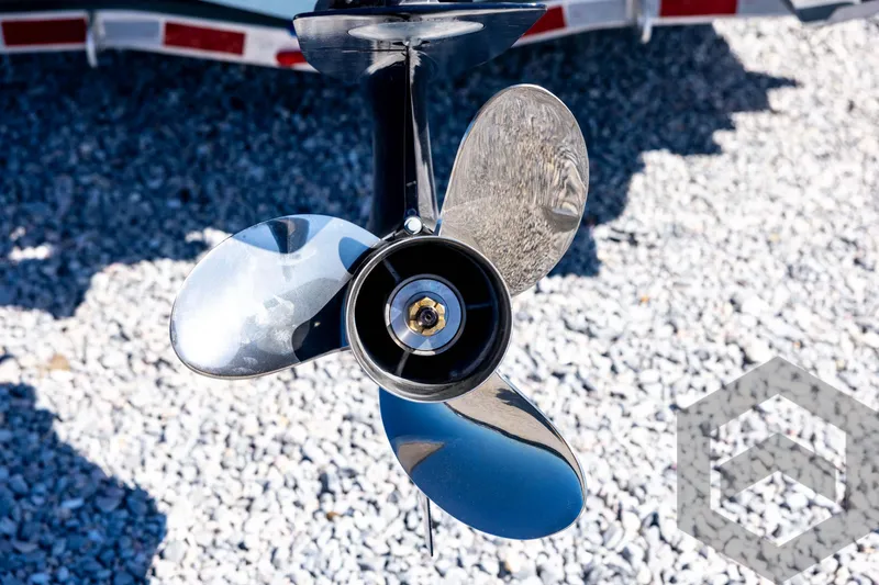 Slide: The Image of Close-up of a 2026 Tidewater 2110 Bay Max boat propeller on gravel. - 22