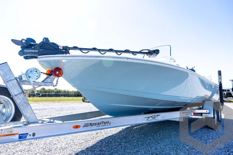 Slide: The Image of 2026 Tidewater 2110 Bay Max boat on trailer with Garmin equipment, outdoor setting. - 29