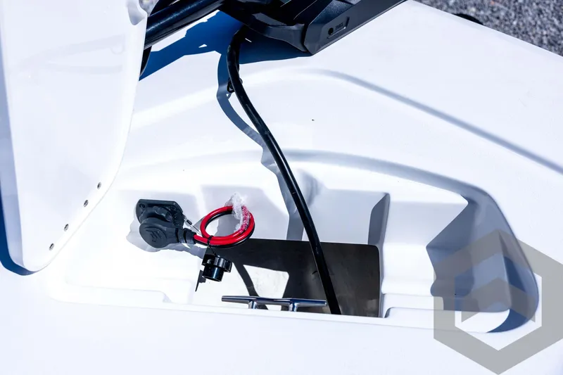 Slide: The Image of 2026 Tidewater 2110 Bay Max boat compartment with wiring and storage features. - 36