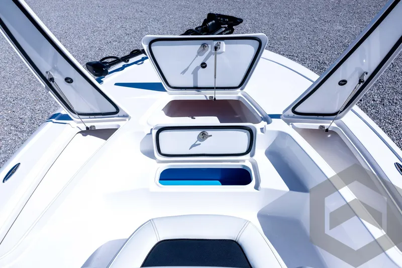 Slide: The Image of 2026 Tidewater 2110 Bay Max boat with open storage compartments on deck. - 37