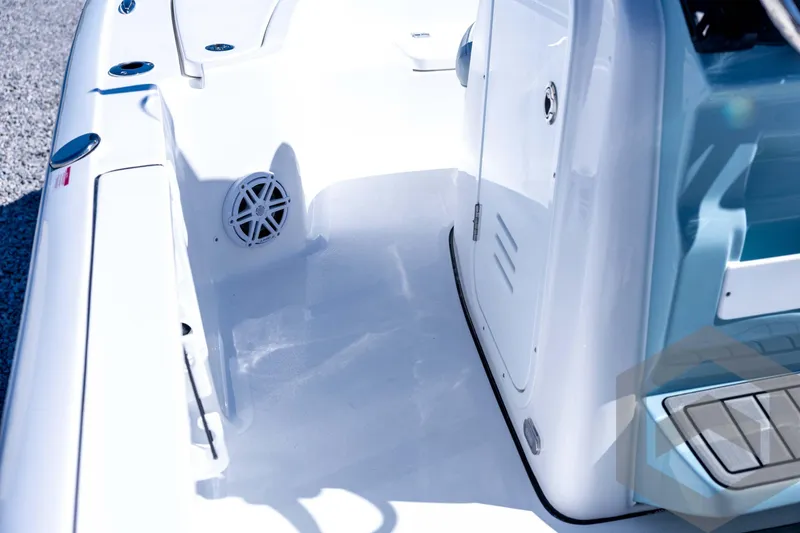 Slide: The Image of 2026 Tidewater 2110 Bay Max boat interior with sleek white design and modern features. - 49