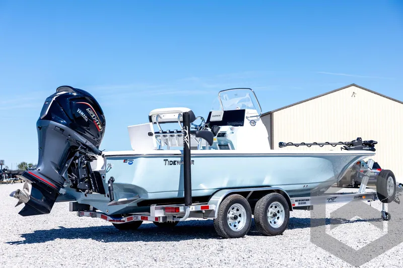 Slide: The Image of 2026 Tidewater 2110 Bay Max boat on trailer with Yamaha engine, parked outdoors. - 5