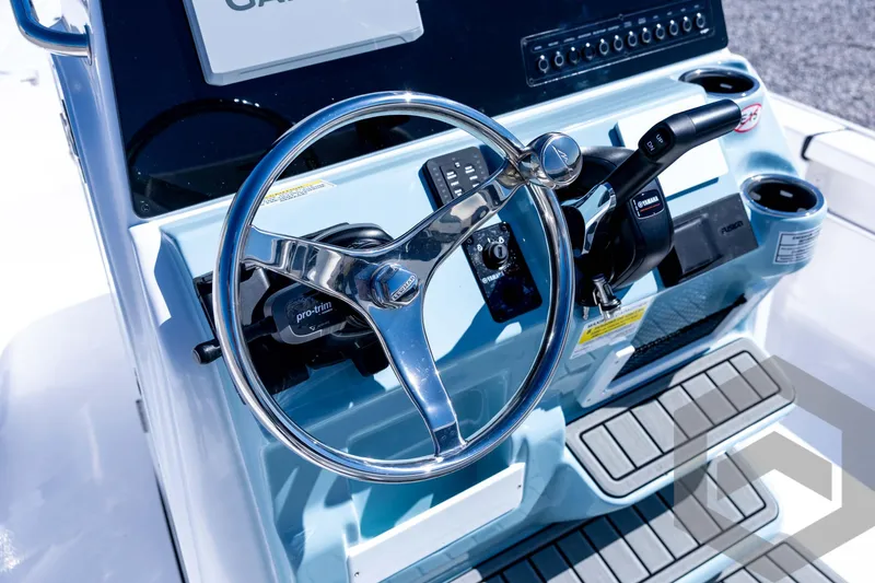 Slide: The Image of Steering console of 2026 Tidewater 2110 Bay Max boat with modern controls. - 54