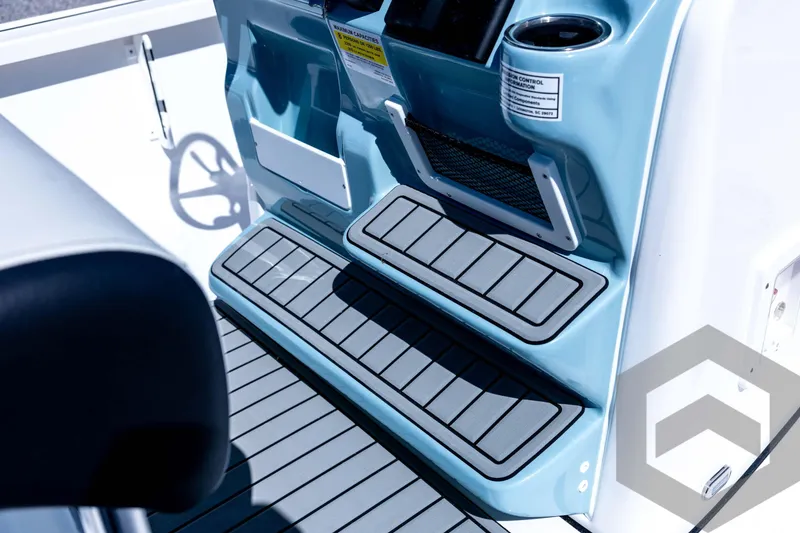 Slide: The Image of Interior view of 2026 Tidewater 2110 Bay Max boat console with steps and cup holder. - 58
