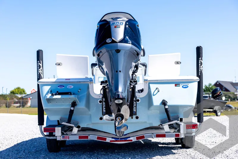 Slide: The Image of 2026 Tidewater 2110 Bay Max boat with Suzuki engine on trailer, rear view. - 6