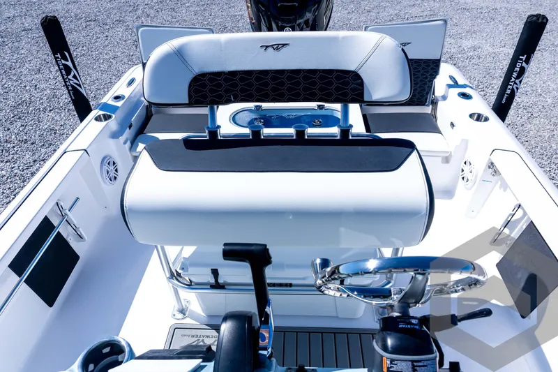 Slide: The Image of 2026 Tidewater 2110 Bay Max boat interior with steering wheel and seating. - 61