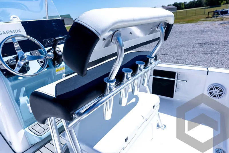Slide: The Image of 2026 Tidewater 2110 Bay Max boat interior with steering wheel and rod holders. - 62
