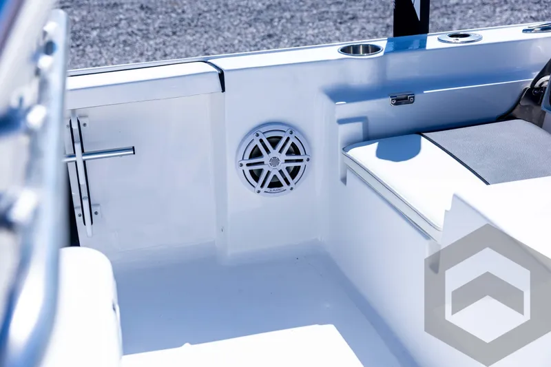 Slide: The Image of 2026 Tidewater 2110 Bay Max boat interior with speaker and seating detail. - 64