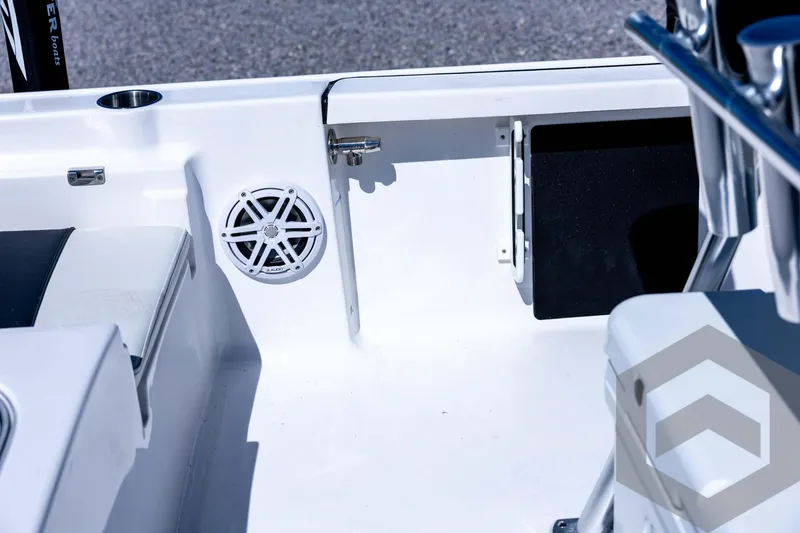 Slide: The Image of 2026 Tidewater 2110 Bay Max boat interior with speaker and seating detail. - 65