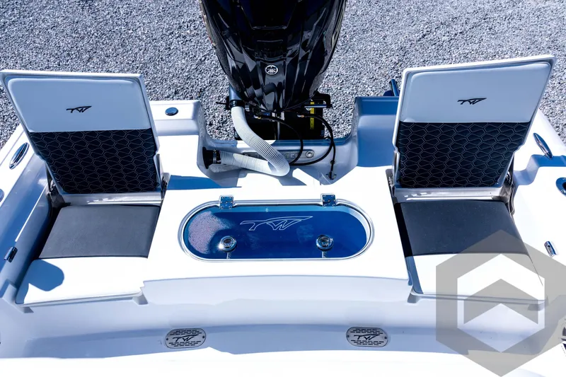Slide: The Image of 2026 Tidewater 2110 Bay Max boat interior with seating and motor, showcasing modern design. - 66
