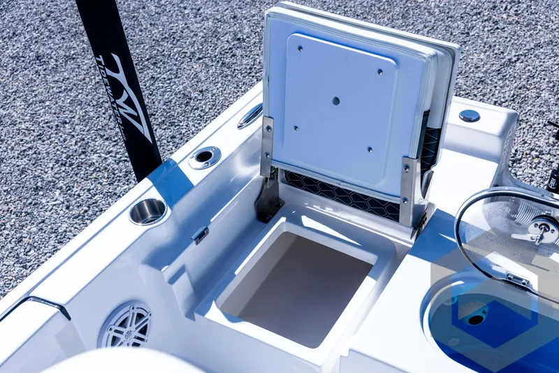 Slide: The Image of 2026 Tidewater 2110 Bay Max boat interior with storage compartment and cup holders. - 69
