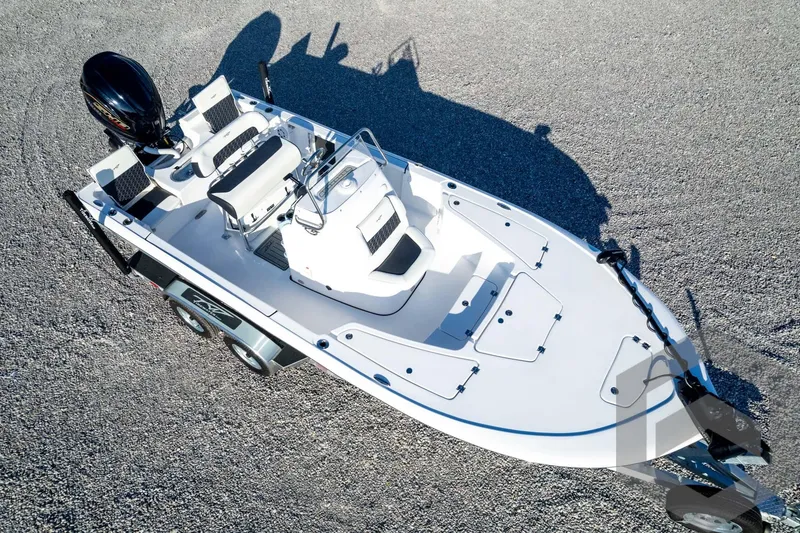 Slide: The Image of 2026 Tidewater 2110 Bay Max boat on trailer, aerial view, parked on gravel. - 84