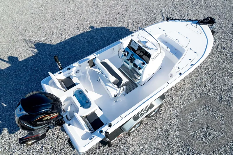 Slide: The Image of 2026 Tidewater 2110 Bay Max boat, aerial view, featuring Yamaha engine and modern console. - 86