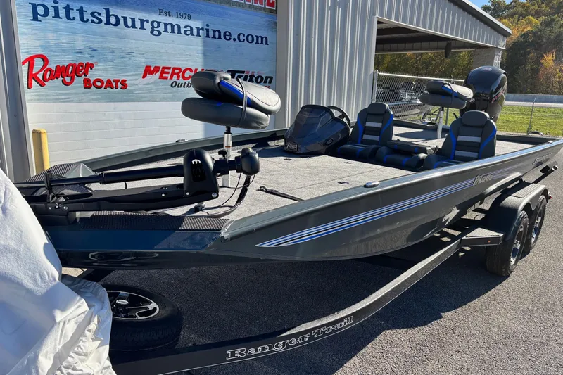 Slide: The Image of 2026 Ranger RT198P fishing boat with green accents at Pittsburg Marine dealership. - 1