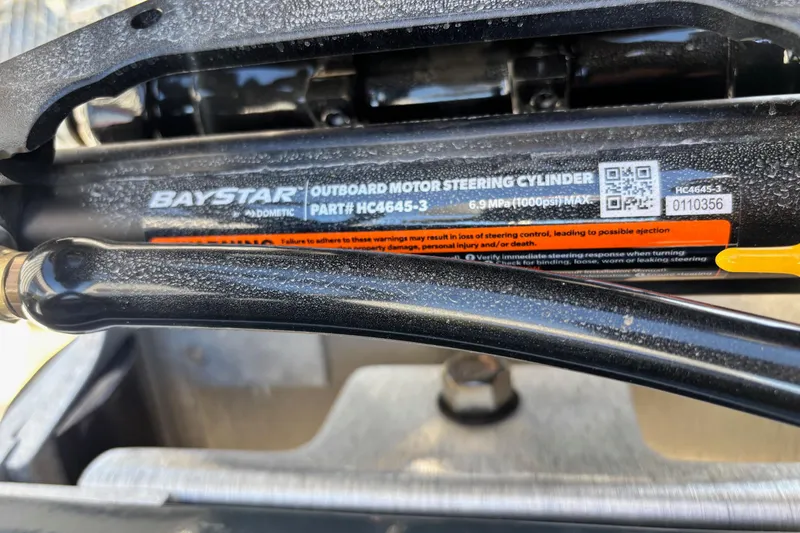 Slide: The Image of 2026 Ranger RT198P boat interior with green-accented seats and storage compartments. - 11