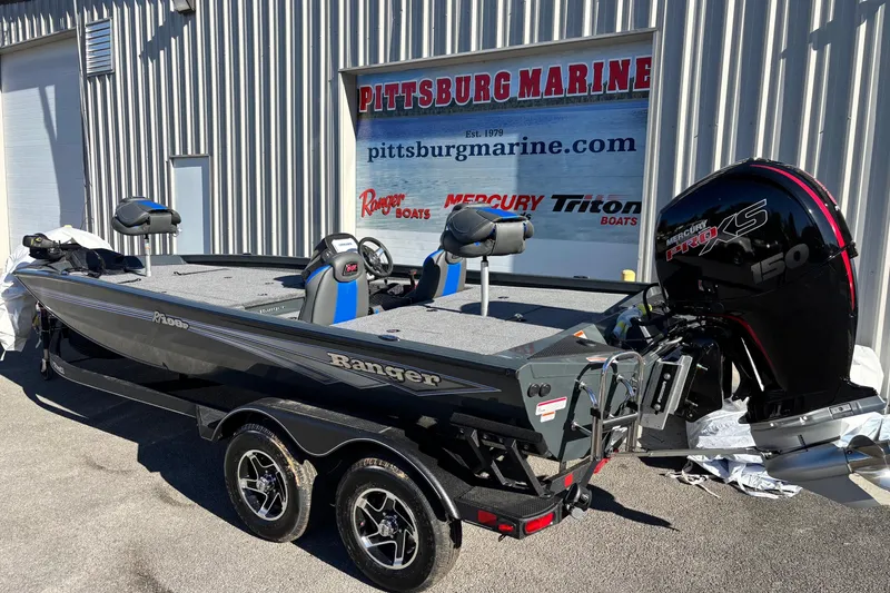 Slide: The Image of 2026 Ranger RT198P boat at Pittsburg Marine dealership, featuring dual-axle trailer and powerful outboard motor. - 14