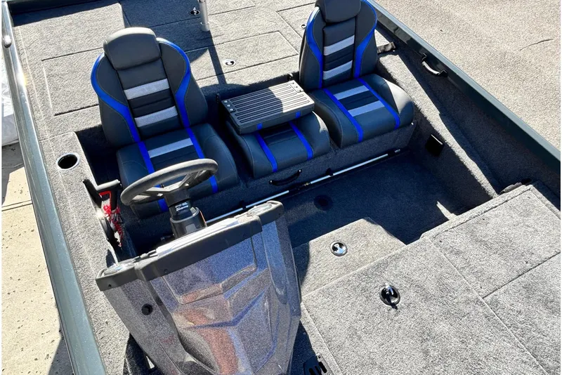 Slide: The Image of Storage compartment in 2026 Ranger RT198P boat, featuring a secure lock and carpeted interior. - 7