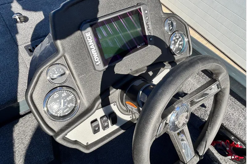 Slide: The Image of 2026 Ranger RT198P boat interior with green-accented seats and center console. - 8