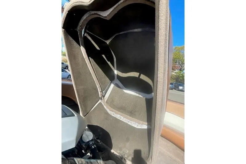 Slide: The Image of 2009 Nautique Ski Nautique 196 engine compartment with open cover, sunny day. - 14