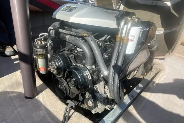 Slide: The Image of Engine of a 2009 Nautique Ski Nautique 196 boat, showcasing mechanical components. - 16