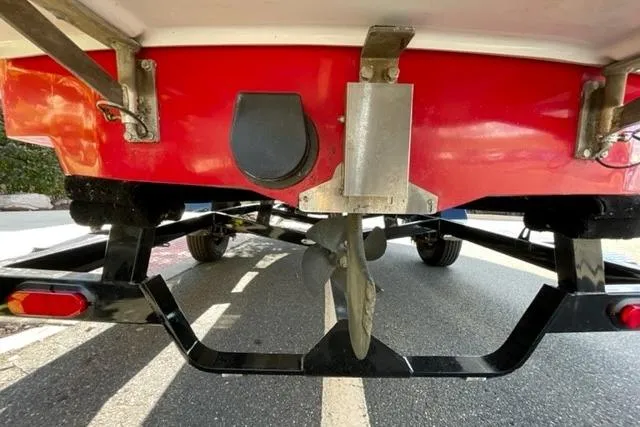 Slide: The Image of 2009 Nautique Ski Nautique 196 boat underside with propeller and trailer. - 25